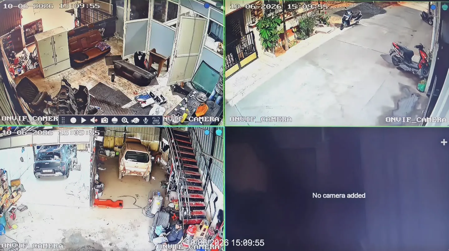 A 4-channel CCTV monitor layout displaying live security footage from a Gopix 5MP IP camera network installation at The Detailing Guru in Thandalam, showing wide-angle high-resolution coverage of the automotive workshop bays, interior office, and external parking lane.