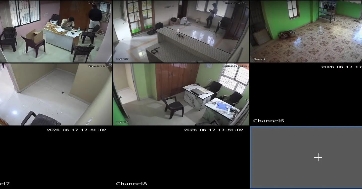 An 8-channel CCTV live view monitor grid displaying real-time security footage from a 5-camera Dahua 2MP Dual Light setup inside the office rooms and service areas of the Lenovo Service Centre in Velachery.