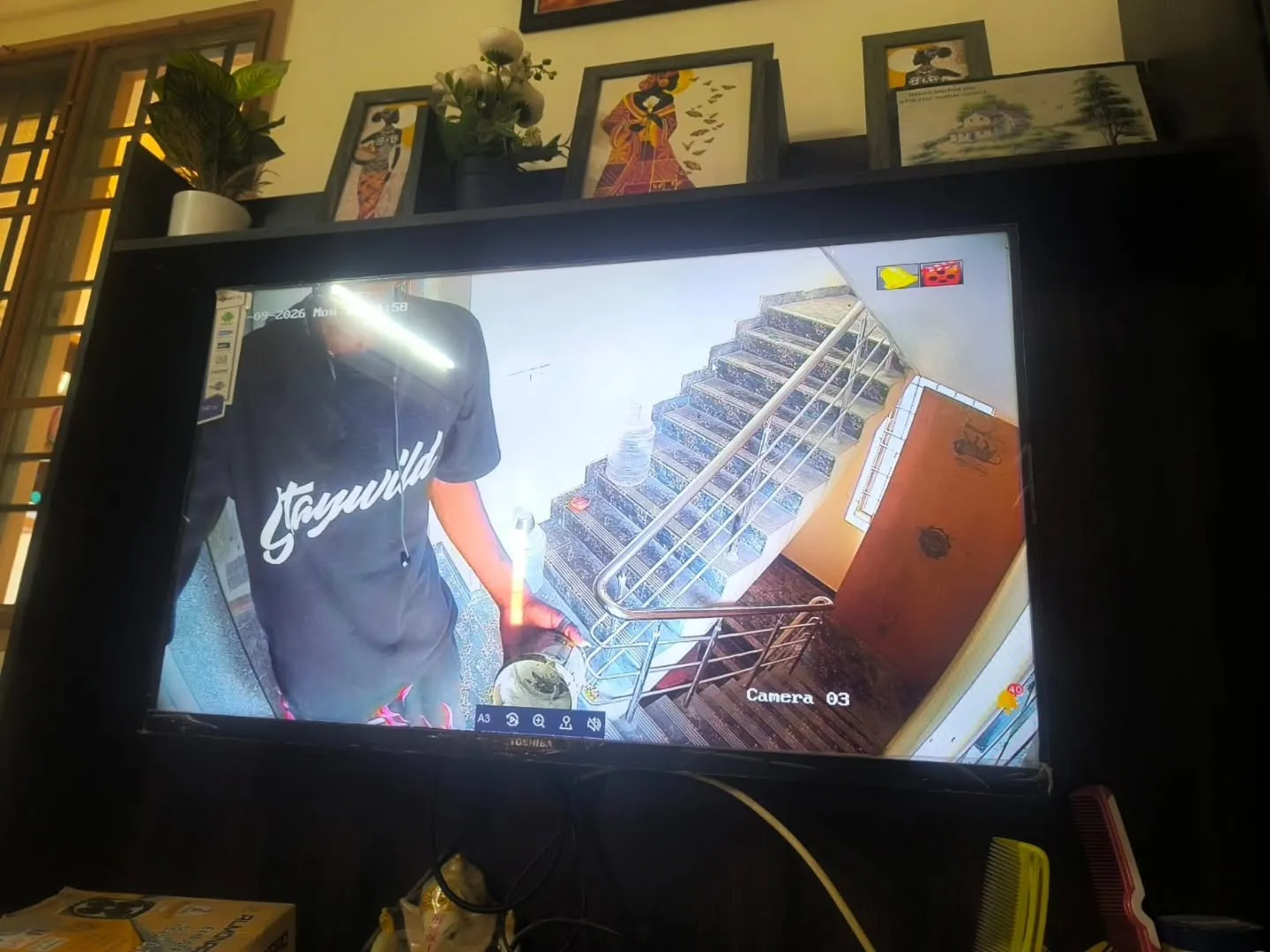 Indoor Hikvision CCTV camera live stream monitoring ground floor staircase landing and residential main entrance door