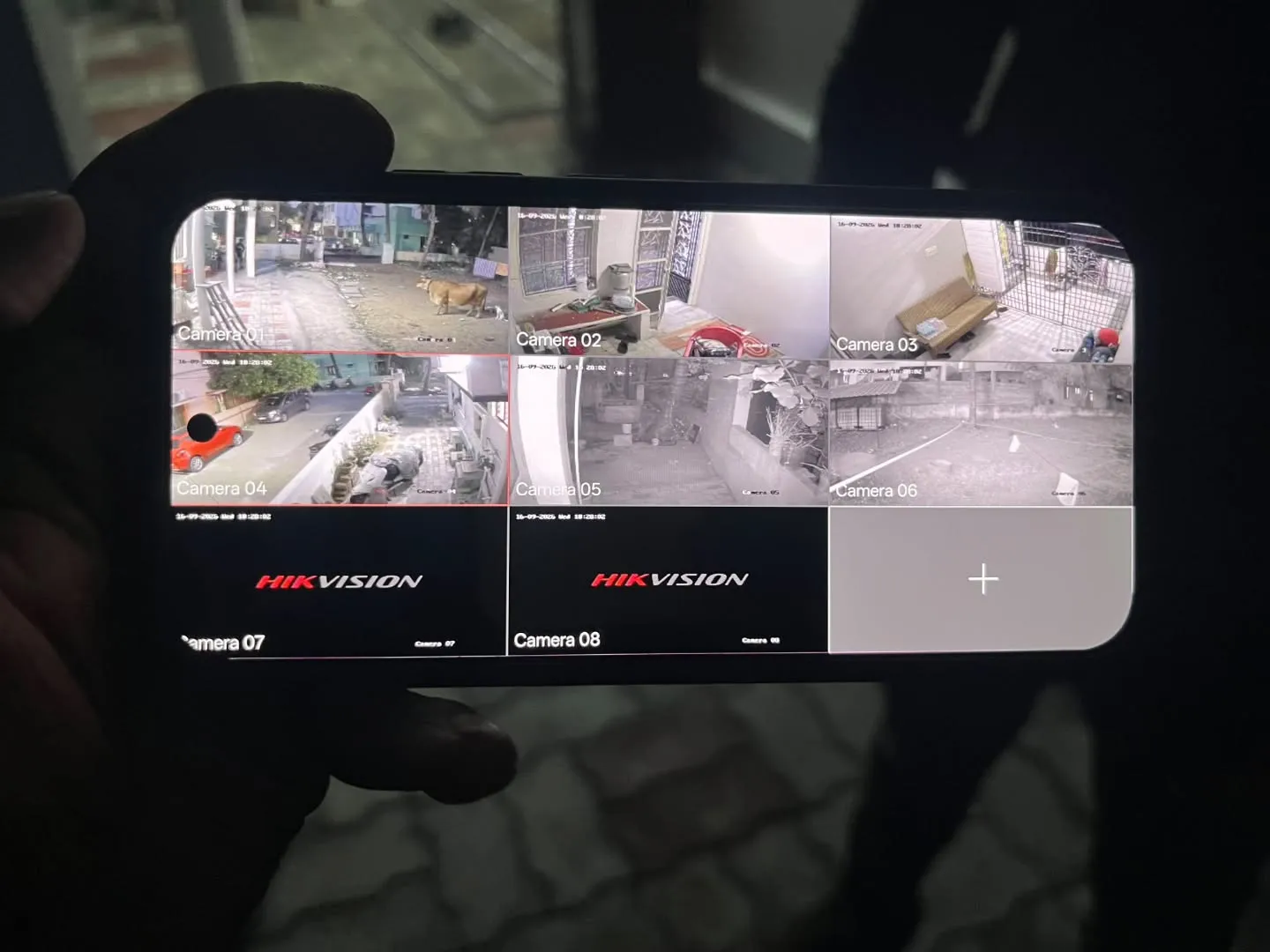 Hikvision 6 camera split screen mobile app live view monitoring residential driveway, gate entry, and perimeter pathway in Tambaram