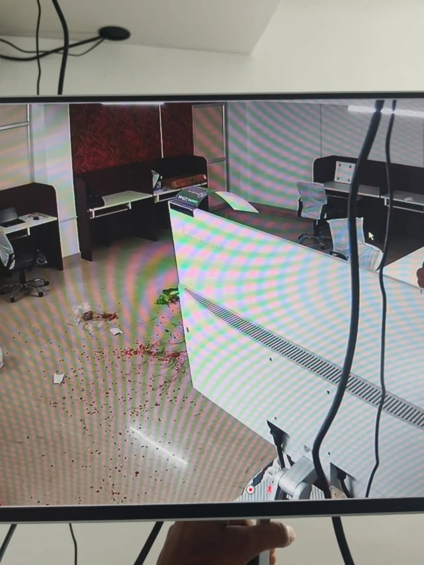 ​A detailed single-channel surveillance feed tracking a corporate office open layout, workstation desks, and office cabins in sharp clarity.